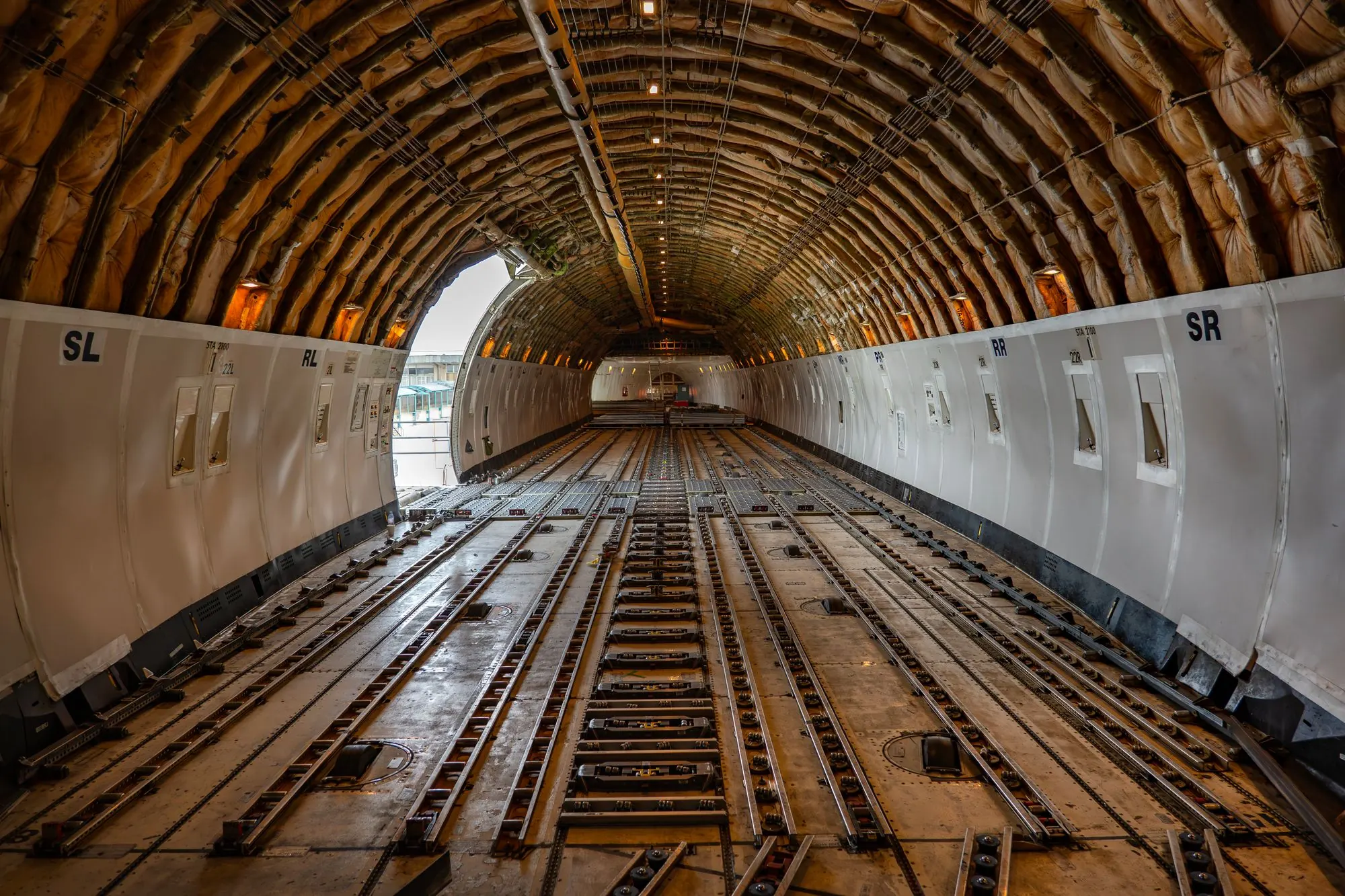 The empty main deck of a cargo aircraft, ready to load